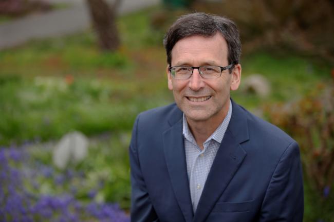 Governor Ferguson headshot in a park wearing blue suit